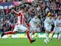 Stoke player Charlie Adam scores from the penalty spot during the Barclays Premier League match between Stoke City and Swansea City at Britannia Stadium on October 19, 2014