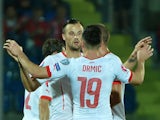 Switzerland's forward Haris Seferovic celebrates with teammates after scoring on October 14, 2014