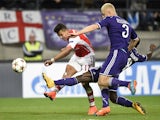Arsenal's Chilean striker Alexis Sanchez has a shot on goal past Anderlecht's defender Olivier Deschacht during a UEFA Champions League group stage football match Anderlecht vs Arsenal at the Constant Vanden Stock stadium in Anderlecht on October 22, 2014