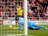 Alexis Sanchez of Arsenal rounds goalkeeper Vito Mannone of Sunderland to score histeam'ssecond goal during the Barclays Premier League match between Sunderland and Arsenal at the Stadium of Light on October 25, 2014