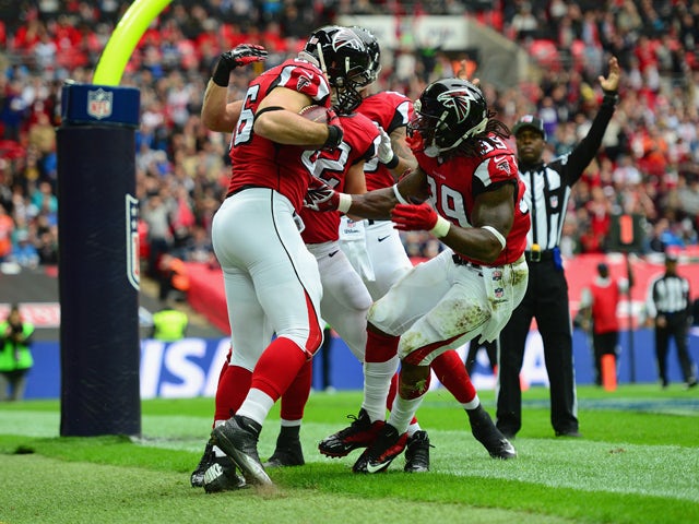 Bear Pascoe #86 of the Atlanta Falcons celebrates scoring a touchdown in the first quarter with Steven Jackson #39 of the Atlanta Falcons during the NFL match between Detroit Lions and Atlanta Falcons at Wembley Stadium on October 26, 2014