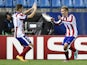 Atletico Madrid's French forward Antoine Griezmann celebrates with Atletico Madrid's Brazilian defender Guilherme Siqueira after scoring the third goal during the UEFA Champions League football match Club Atletico de Madrid vs Malmo FF at the Vicente Cald