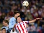 Malmo's defender Erik Johansson vies with Atletico Madrid's midfielder Saul Niguez during the UEFA Champions League football match Club Atletico de Madrid vs Malmo FF at the Vicente Calderon stadium in Madrid on October 22, 2014