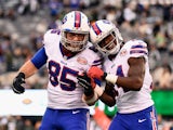 Sammy Watkins #14 of the Buffalo Bills celebrates his 61-yard touchdown with teammate Lee Smith #85 against the New York Jets in the fourth quarter at MetLife Stadium on October 26, 2014