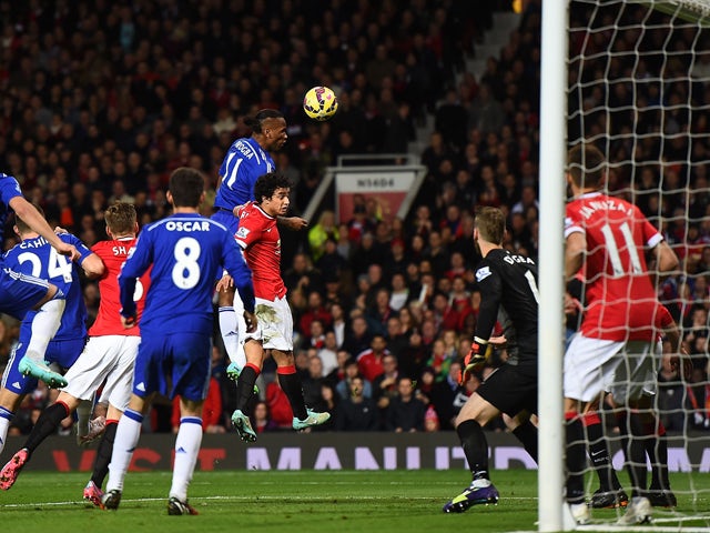  Didier Drogba of Chelsea scores the first goal during the Barclays Premier League match between Manchester United and Chelsea at Old Trafford on October 26, 2014 