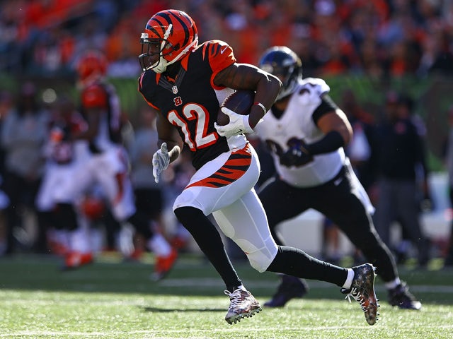 Mohamed Sanu #12 of the Cincinnati Bengals runs with the ball after catching a pass during the third quarter of the game against the Baltimore Ravens at Paul Brown Stadium on October 26, 2014