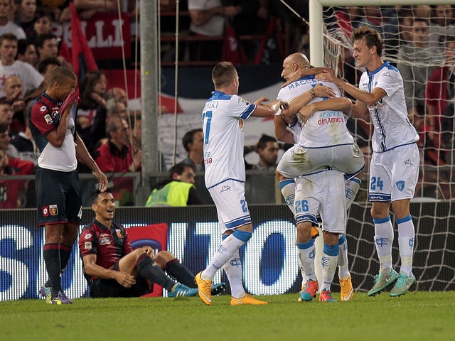 Empoli FC players celebrate a goal scored by Lorenzo Tonelli #26 during the Serie A match between Genoa CFC and Empoli FC at Stadio Luigi Ferraris on October 20, 2014