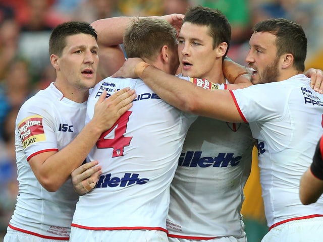 Joel Tomkins of England celebrates a try with team mates during the Four Nations match between England and Samoa at Suncorp Stadium on October 25, 2014
