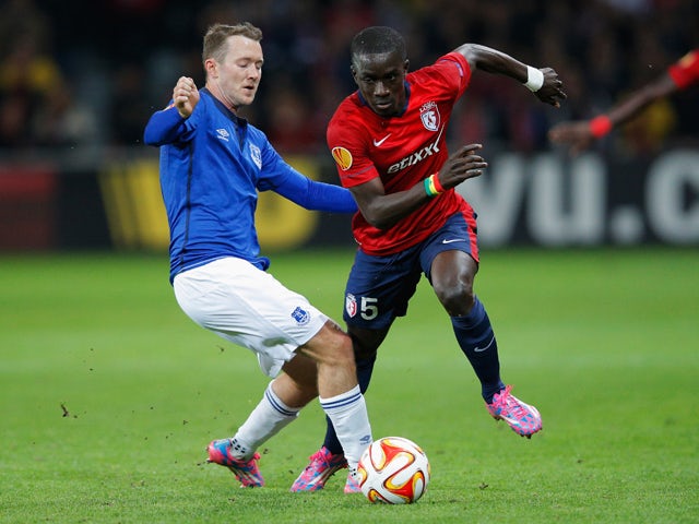 Idrissa Gueye of Lille evades Aidan McGeady of Everton during the UEFA Europa League Group H match between LOSC Lille and Everton at Grand Stade Lille Metropole on October 23, 2014