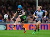 Jack Nowell of Exeter Chiefs kicks away from Fionn Carr of Connacht during the European Rugby Challenge Cup match between Exeter Chiefs and Connacht at Sandy Park on October 25, 2014