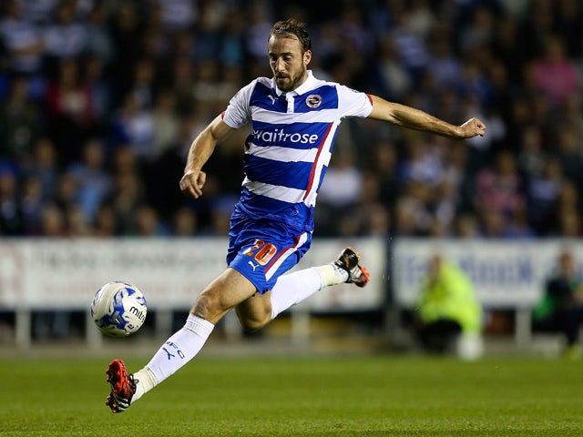 Glenn Murray of Reading in action during the Sky Bet Championship match between Reading and Millwall at Madejski Stadium on September 16, 2014