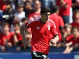 Goncalo Guedes of SL Benfica runs with the ball during the UEFA Youth League Semi Final match between Real Madrid and Benfica Lisbon at Colovray Stadion on April 11, 2014