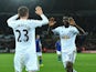 Swansea City striker Wilfried Bony celebrates with teammate Gylfi Sigurdsson after scoring the opening goal against Leicester City in the Premier League on October 25, 2014