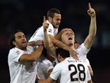 Emil Hallfredsson of Verona celebrates the opening goal during the Serie A match between SSC Napoli and Hellas Verona FC at Stadio San Paolo on October 26, 2014