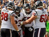 Running back Arian Foster #23 of the Houston Texans is congratulated by teammates Garrett Graham #88, Ben Jones #60, and Chris Myers #55, after scoring a touchdown against the Tennessee Titans at LP Field on October 26, 2014