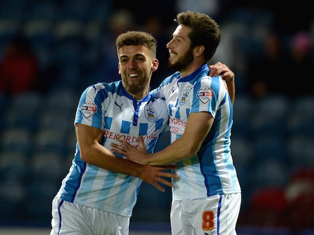Jacob Butterfield of Huddersfield celebrates scoring the opening goal with Tommy Smith during the Sky Bet Championship match against Brighton on October 21, 2014