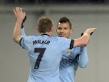 Manchester City's English midfielder James Milner celebrates with Argentinian striker Sergio Aguero after scoring his team's second goal during the UEFA Champions League match at CSKA Moscow on October 21, 2014
