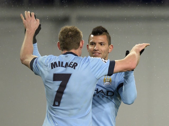 Manchester City's English midfielder James Milner celebrates with Argentinian striker Sergio Aguero after scoring his team's second goal during the UEFA Champions League match at CSKA Moscow on October 21, 2014