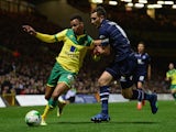 Jason Pearce of Leeds United battles with Josh Murphy of Norwich City during the Sky Bet Championship match on October 21, 2014