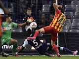 Lens' French midfielder Alharbi El Jadeyaoui scores a goal past Toulouse's French goalkeeper Zacharie Boucher during the French first division football match Toulouse FC vs RC Lens at the Municipal Stadium in Toulouse on October 24, 2014