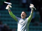 Lukasz Zaluska of Celtic celebrates at full-time following the Clydesdale Bank Premier League match between Hibernian and Celtic at Easter Road on July 24, 2011
