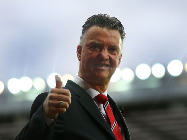 Manchester United Manager Louis van Gaal gives a thumbs up prior to the Barclays Premier League match between Manchester United and Chelsea at Old Trafford on October 26, 2014