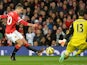 Manchester United's Dutch striker Robin van Persie shoots but Chelsea's Belgian goalkeeper Thibaut Courtois saves during the English Premier League football match between Manchester United and Chelsea at Old Trafford in Manchester, north west England, on 