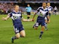 Besart Berisha of the Victory celebrates a goal with Archie Thompson during the round three A-League match between the Melbourne Victory and Melbourne City at Etihad Stadium on October 25, 2014