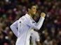 Real Madrid's Portuguese forward Cristiano Ronaldo celebrates scoring the opening goal during the UEFA Champions League, group B, football match between Liverpool and Real Madrid at Anfield in Liverpool, northwest England, on October 22, 2014