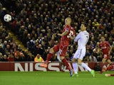 Real Madrid's Portuguese forward Cristiano Ronaldo scores the opening goal during the UEFA Champions League, group B, football match between Liverpool and Real Madrid at Anfield in Liverpool, northwest England, on October 22, 2014