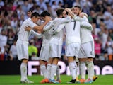 Real Madrid players celebrate after scoring their third goal against Barcelona in La Liga's El Clasico on October 25, 2014