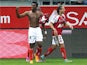 Reims' forward Benjamin Moukandjo celebrates after scoring during the French L1 football match between Reims (SR) and Montpellier (MHSC) in Reims, northern France on October 25, 2014