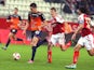 Reims' French defender Franck Signorino vies with Montpellier's French midfielder Jonas Martin during the French L1 football match Reims vs Montpellier, on October 25, 2014