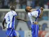 Porto's forward and captain Ricardo Quaresma (R) celebrates with teammate Dutch defender Bruno Martins Indi after scoring a goal during the UEFA Champions League football match against Bilbao on October 21, 2014