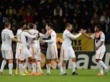 Shakhtar Donetsk's players celebrate after scoring a goal during the UEFA Champions League group H football match against BATE on October 21, 2014