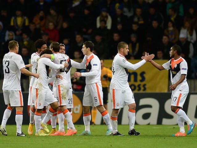 Shakhtar Donetsk's players celebrate after scoring a goal during the UEFA Champions League group H football match against BATE on October 21, 2014