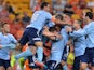 Marc Janko of Sydney is congratulated by team mates after scoring a goal during the round three A-League match between Brisbane Roar and Sydney FC at Suncorp Stadium on October 24, 2014