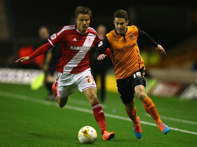 Tommy Rowe of Wolverhampton Wanderers tangles with Jelle Vossen of Middlesbrough during the Sky Bet Championship match on October 21, 2014