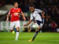 Saido Berahino of West Bromwich Albion scores their second goal as Rafael of Manchester United looks on during the Barclays Premier League match between West Bromwich Albion and Manchester United at The Hawthorns on October 20, 2014