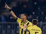Young Boys' French forward Guillaume Hoarau gestures as he celebrates his team's first goal with teammate Swiss defender Steve von Bergen during the UEFA Europa League Group I football match between BSC Young Boys and SSC Napoli in Bern on October 23, 201
