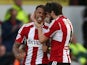 Andre Gray of Brentford celebrates with Jonathan Douglas of Brentford after he scores to make it 1-1 during the Sky Bet Championship match against Derby on November 1, 2014