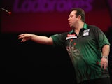 Brendan Dolan of Northern Ireland in action during his second round match against Gary Anderson of England during the Ladbrokes.com World Darts Championship on December 22, 2013