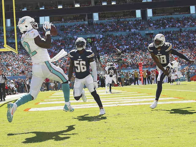Tight end Charles Clay #42 of the Miami Dolphins catches a first quarter touchdown pass from quarterback Ryan Tannehill against the San Diego Chargers on November 2, 2014