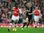 Danny Welbeck of Arsenal and David Jones of Burnley (R) in action during the Barclays Premier League match on November 1, 2014