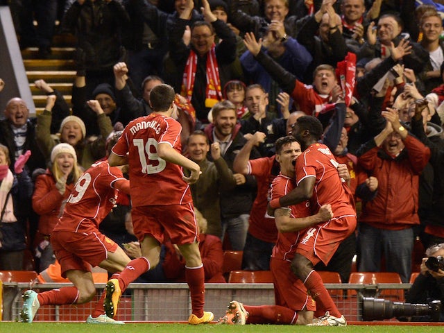 Dejan Lovren of Liverpool celebrates scoring the winning goal during the Capital One Cup Fourth Round match between Liverpool and Swansea City at Anfield on October 28, 2014