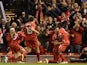 Dejan Lovren of Liverpool celebrates scoring the winning goal during the Capital One Cup Fourth Round match between Liverpool and Swansea City at Anfield on October 28, 2014
