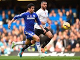 Diego Costa of Chelsea and Steven Caulker of Queens Park Rangers chase the ball during the Barclays Premier League match on November 1, 2014