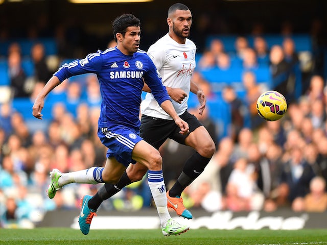 Diego Costa of Chelsea and Steven Caulker of Queens Park Rangers chase the ball during the Barclays Premier League match on November 1, 2014