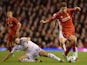 Fabio Borini of Liverpool is tackled by Angel Rangel of Swansea during the Capital One Cup Fourth Round match on October 28, 2014
