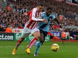 Geoff Cameron of Stoke City competes with Alex Song of West Ham during the Barclays Premier League match on November 1, 2014